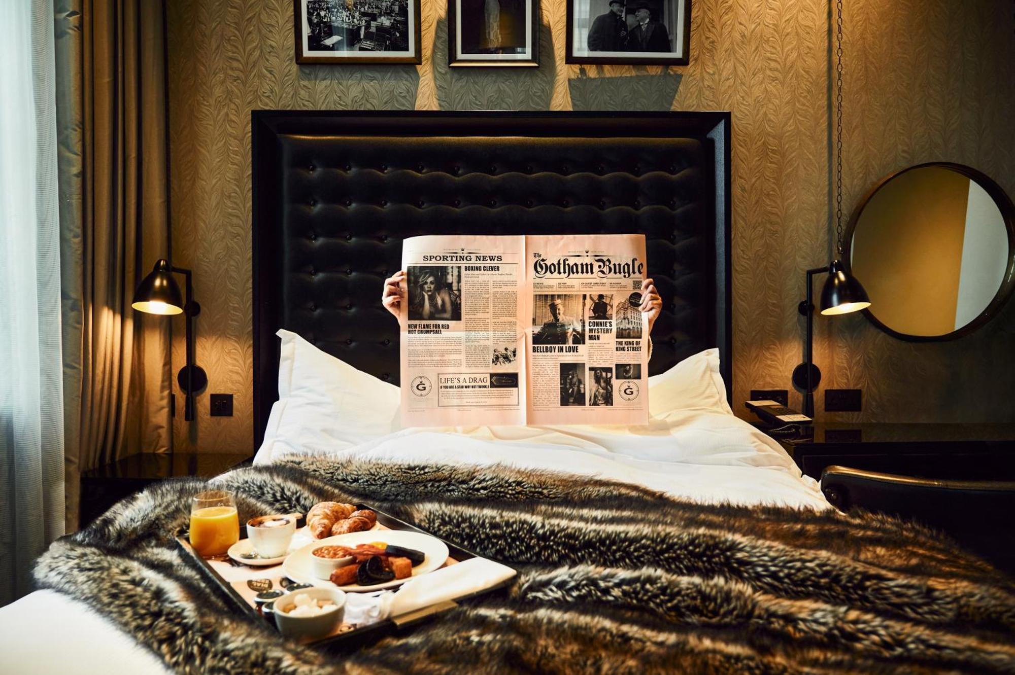 Hotel Gotham Manchester Exterior photo A guest reading the Financial Times in a hotel room